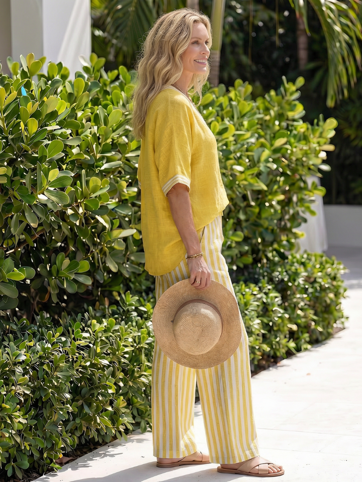 Spring/summer women's two-piece: relaxed V-neck tunic & striped wide-leg comfortable pants.