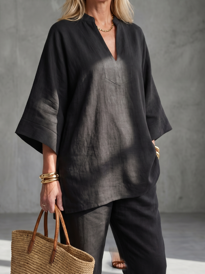 Versatile women's two-piece set. Relaxed V-neck tunic and trousers for loungewear or casual chic.