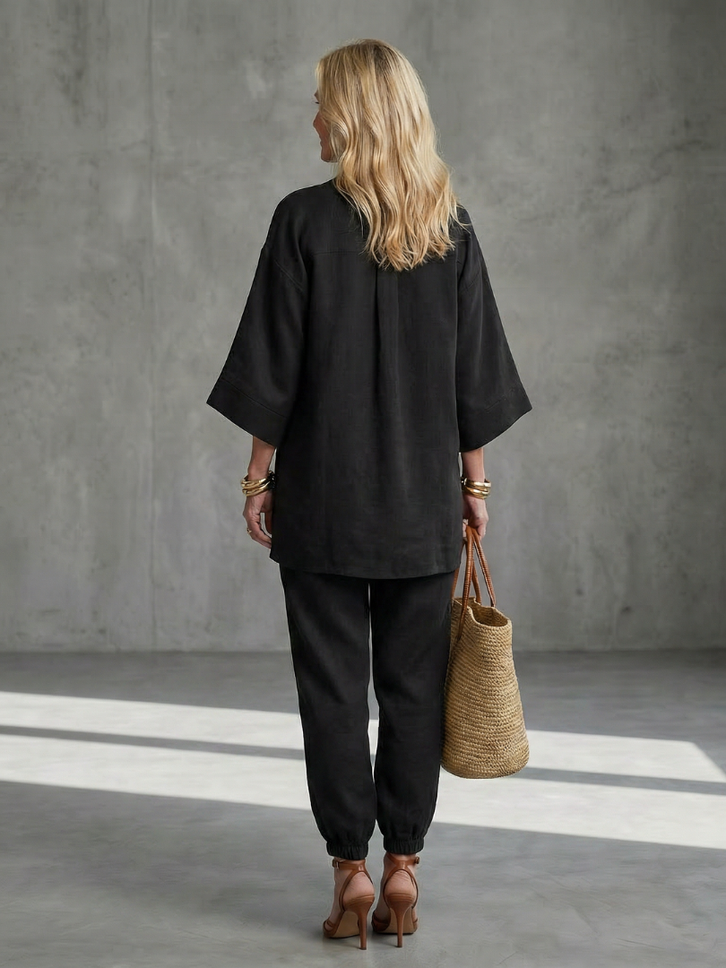 Women's V-neck tunic & gathered trouser set with wide sleeves. Relaxed fit for comfort & style.