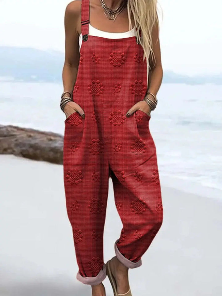 Versatile women's wide-leg jumpsuit, a comfortable summer outfit with adjustable straps and roomy pockets.