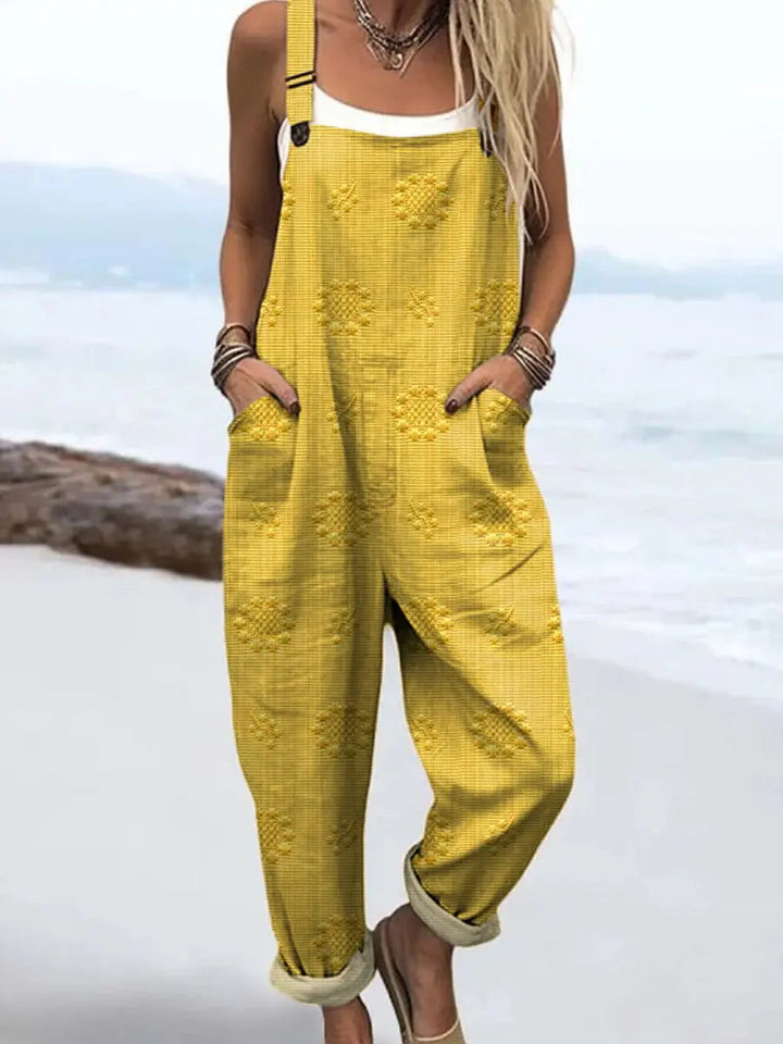 Stylish women's wide-leg jumpsuit featuring practical pockets and adjustable shoulder straps for a custom fit.
