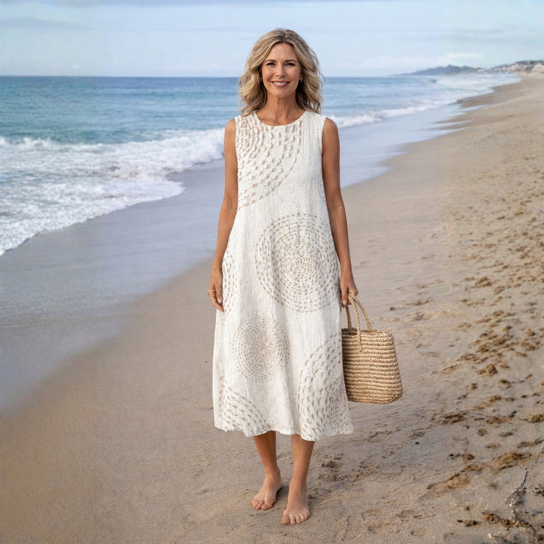 Comfortable women's printed retro midi dress, sleeveless for summer, featuring a round neck and convenient pockets.