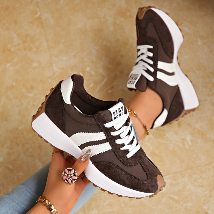 Front view of women's retro casual lace-up trainers. Fashion sneakers designed for everyday comfort & style.