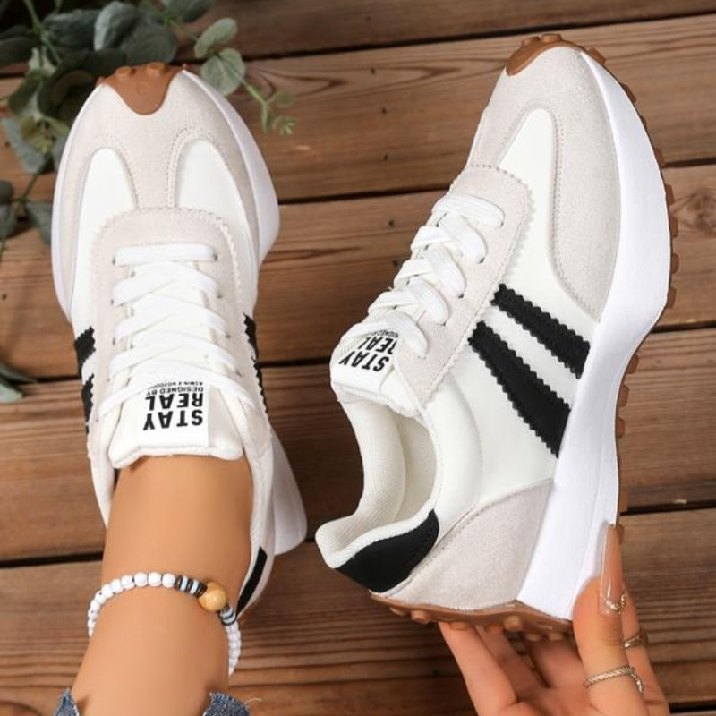 Retro women's casual trainers, offering everyday comfort. Stylish lace-up walking shoes & supportive fashion sneakers.