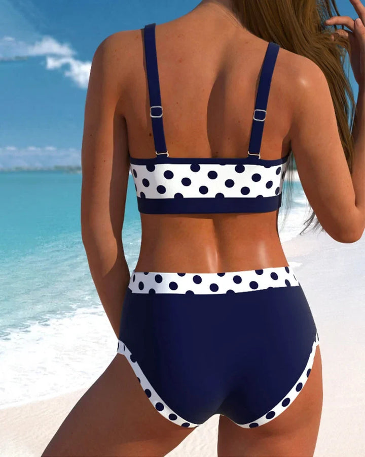 Stylish women's vintage polka-dot high-waisted bikini with V-neck top & bow detail. Perfect summer swim set.