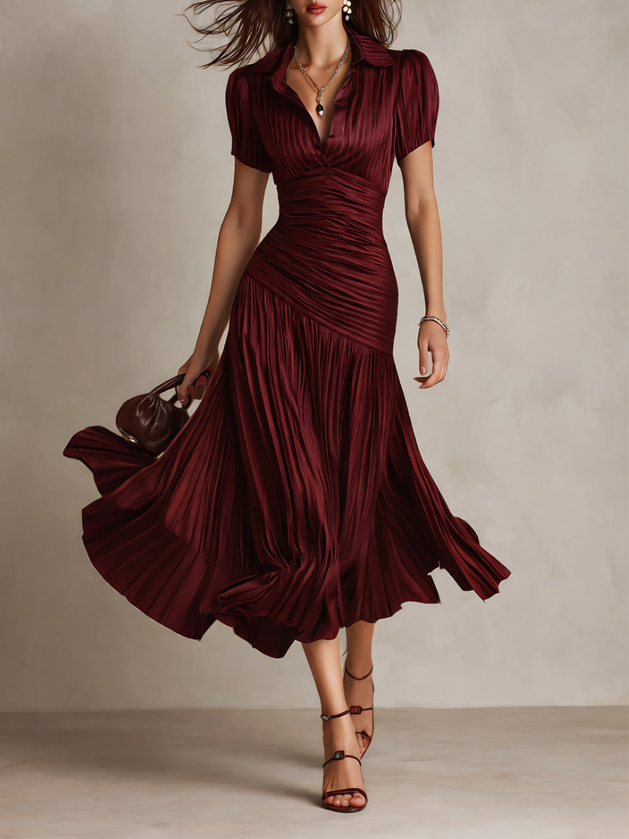Woman wearing a flattering retro striped midi dress with short sleeves, showcasing elegant spring/summer fashion.