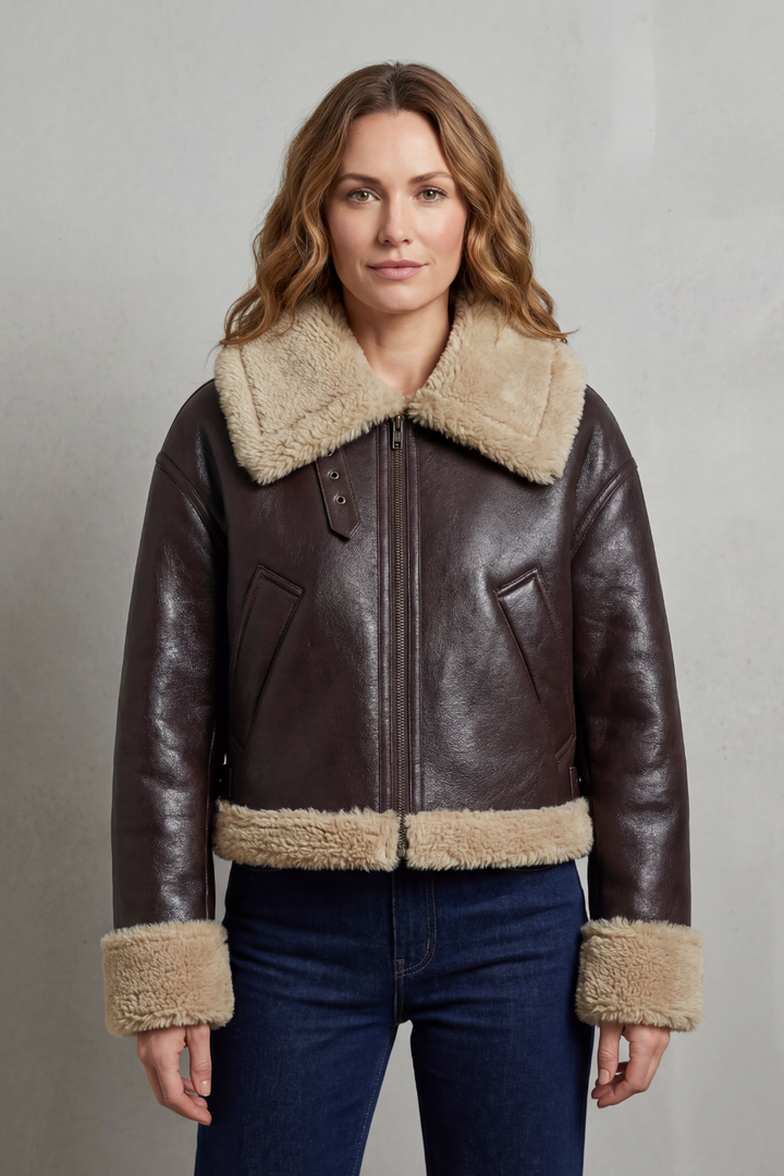 Stylish women's cropped aviator jacket, reversible design, perfect for casual outerwear.