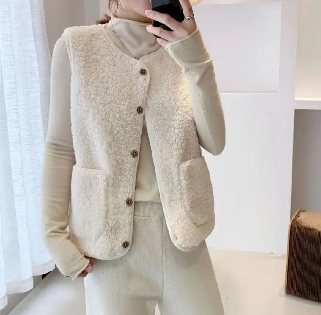 Women's reversible puffer vest with buttons. Sherpa fleece gilet, a cozy winter & autumn layering piece.