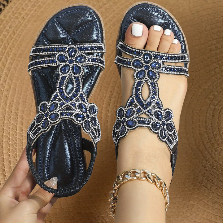 Women's open-toe flat sandals adorned with shimmering rhinestones and crystal detailing for summer.