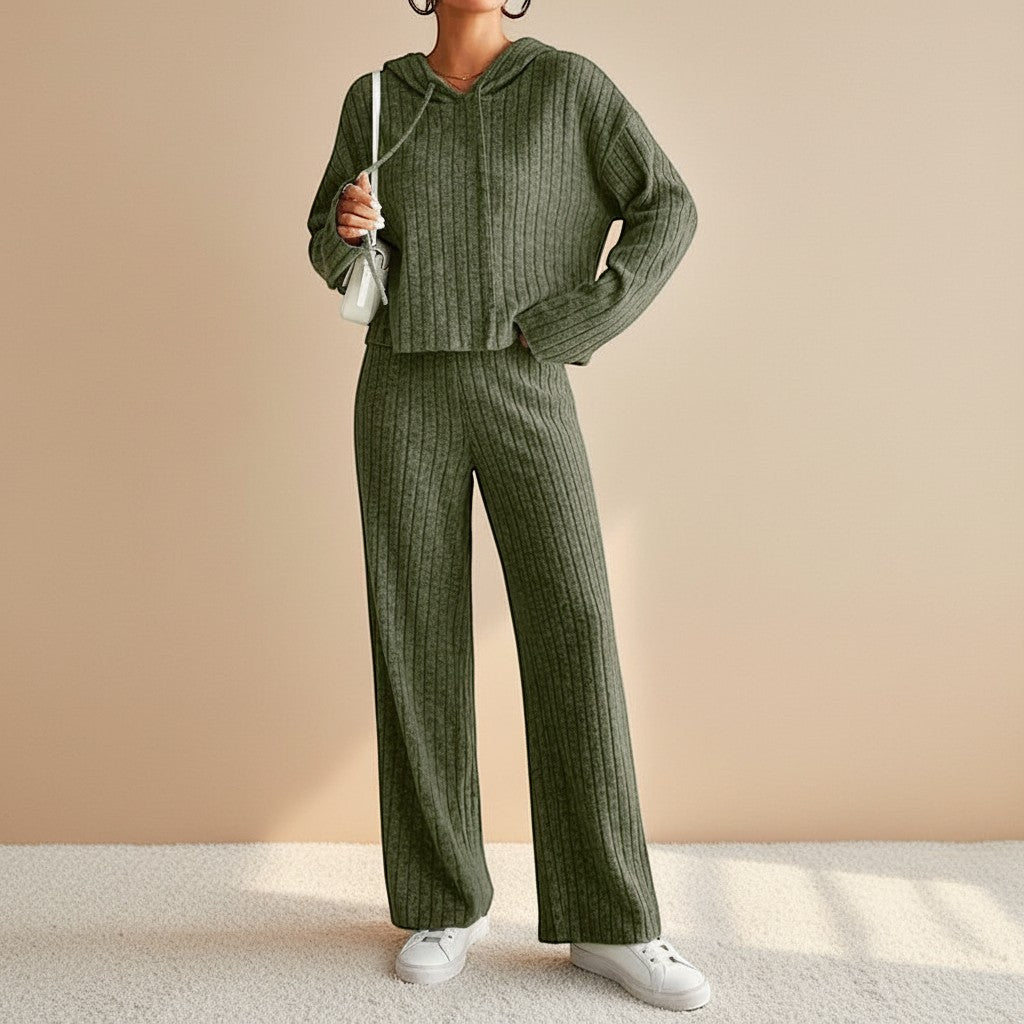 Soft ribbed hoodie and relaxed fit pants in a women's two-piece loungewear set. Ultimate cozy comfort fashion.