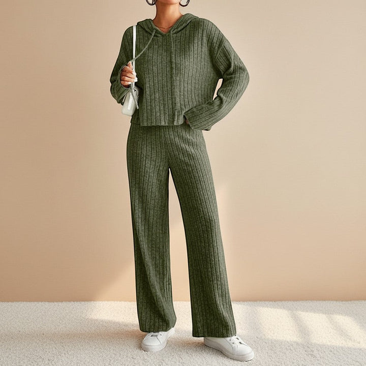 Soft ribbed hoodie and relaxed fit pants in a women's two-piece loungewear set. Ultimate cozy comfort fashion.