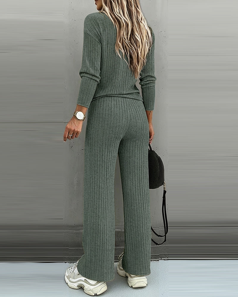 Pullover v-neck knit top paired with women's straight leg pants