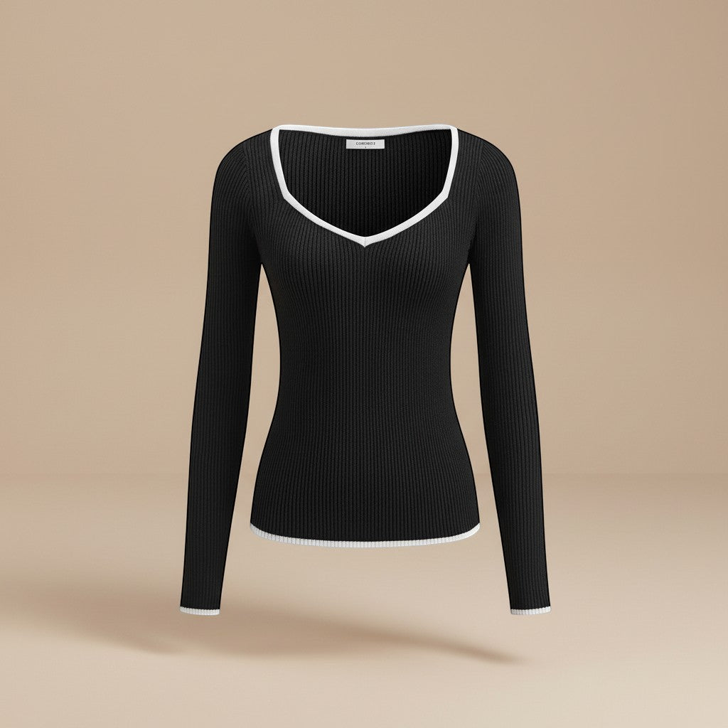 Stylish women's fitted ribbed top, long sleeve with V-neck and eye-catching contrast trim.