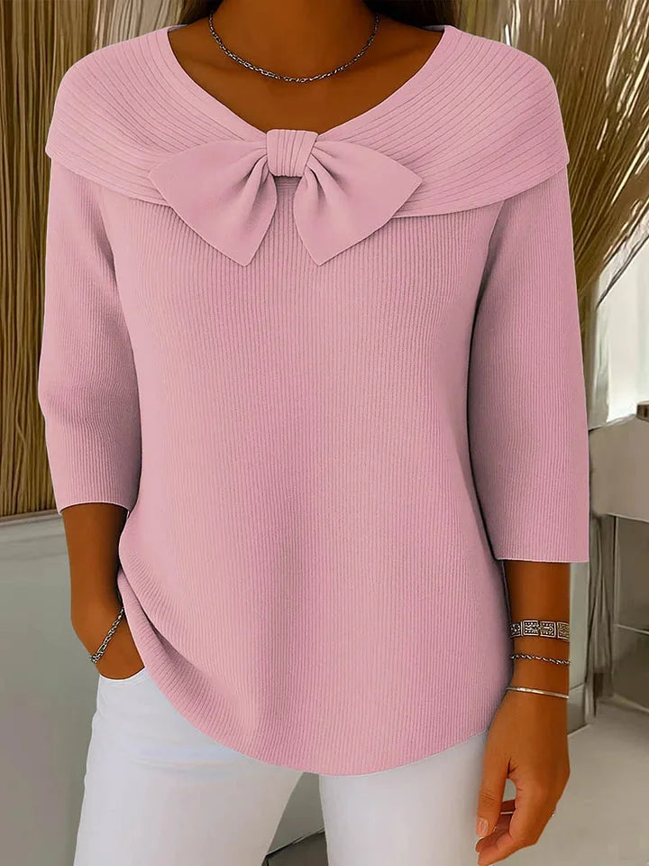 Feminine women's ribbed knit V-neck sweater, featuring a stylish bow and comfortable 3/4 sleeves.