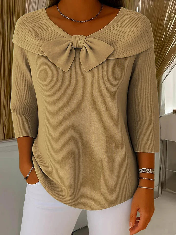 Versatile women's V-neck ribbed sweater with chic bow accent, ideal for elegant or casual outfits.