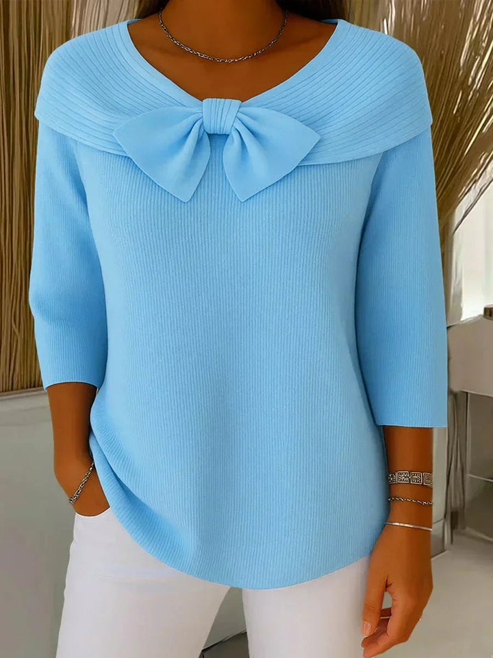 Comfortable women's V-neck ribbed sweater, featuring a unique bow accent & practical 3/4 sleeves.