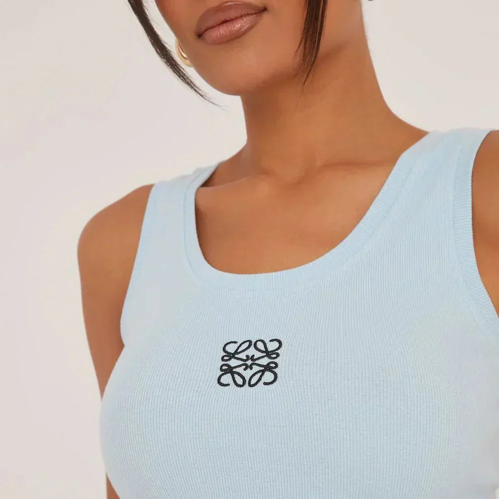 Women's versatile ripped tank top, adorned with delicate embroidery, for a fashionable summer.