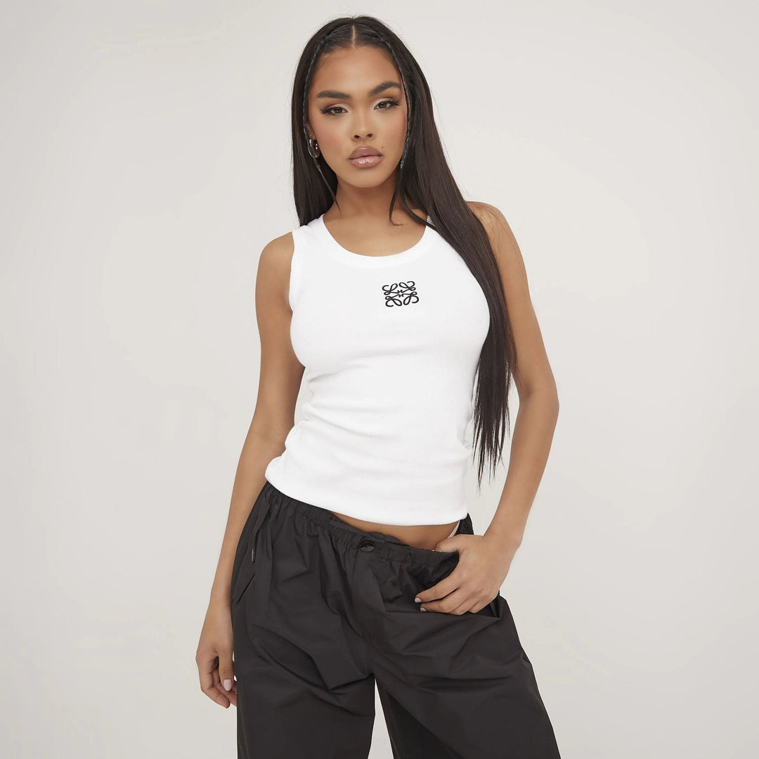 Fashion-forward women's top: chic ripped design combined with beautiful delicate embroidery.