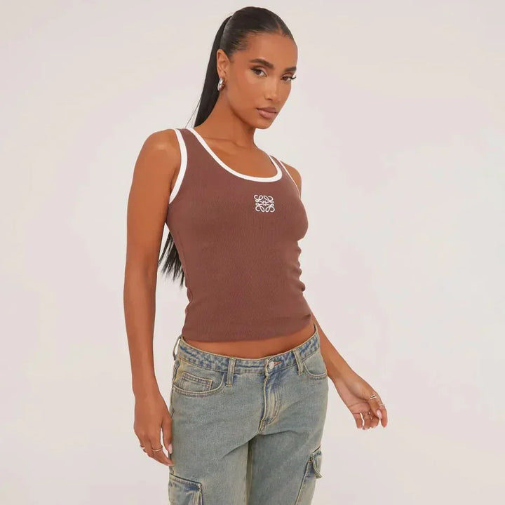 Women's chic summer top with trendy rips and elegant delicate embroidery, versatile and fresh.