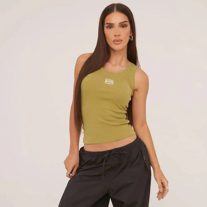 Delicately embroidered ripped tank top for women, embodying chic and versatile summer fashion.