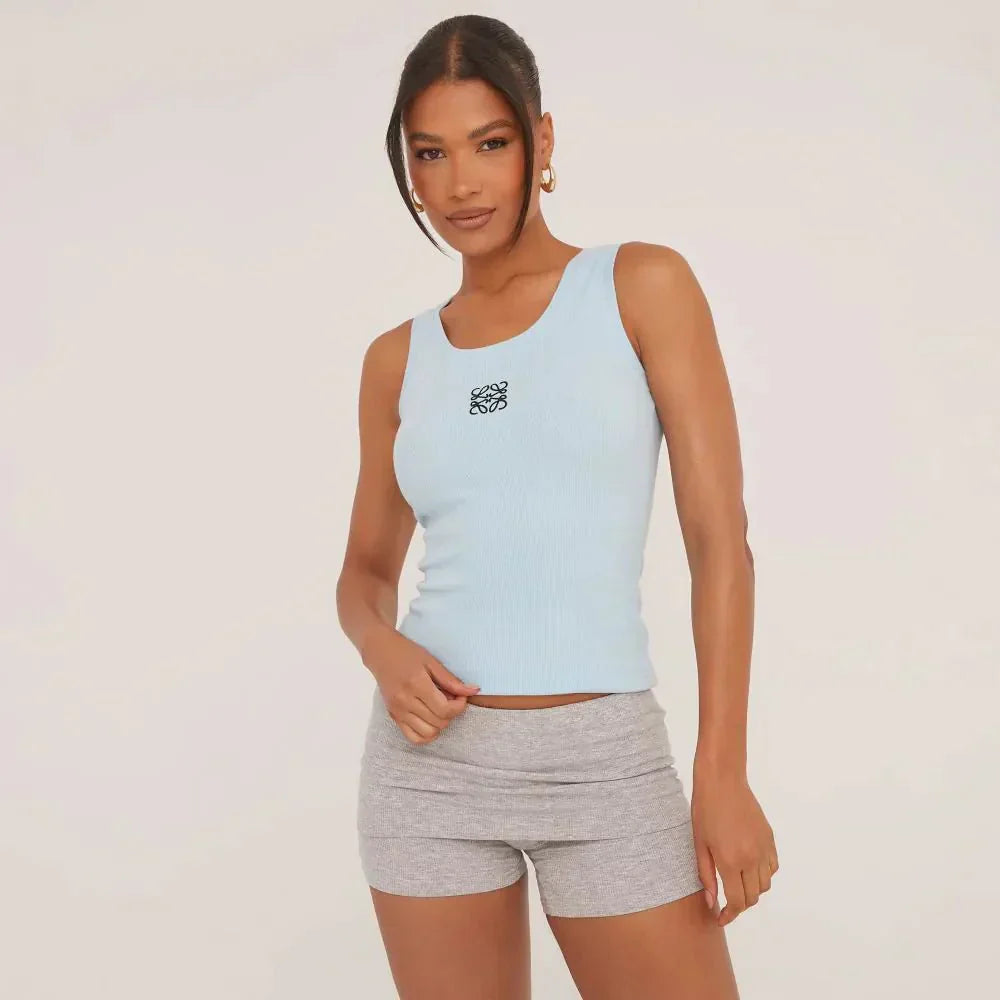 Stylish women's sleeveless top, featuring a ripped texture and beautiful delicate embroidery.