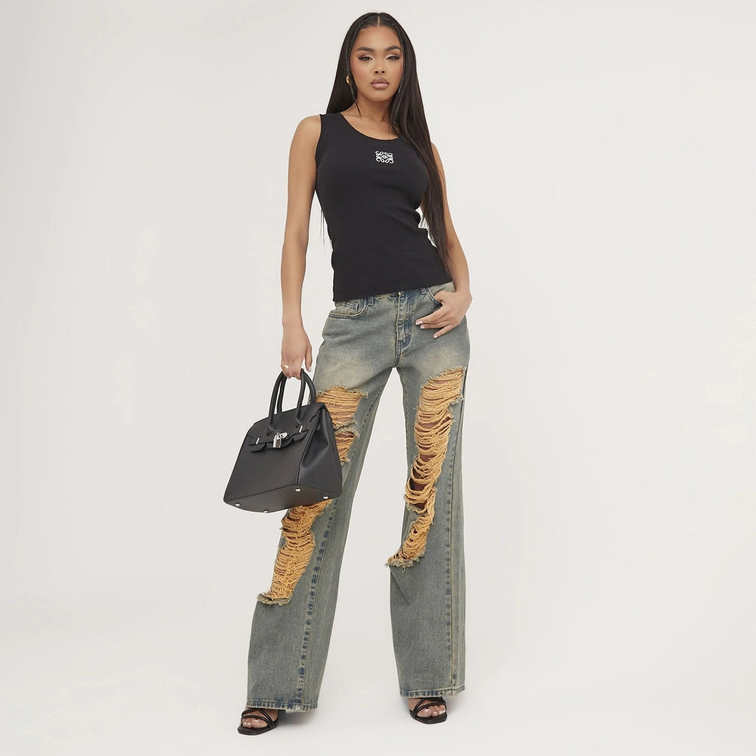 Ripped and embroidered women's tank top, perfect for a casual yet sophisticated summer style.