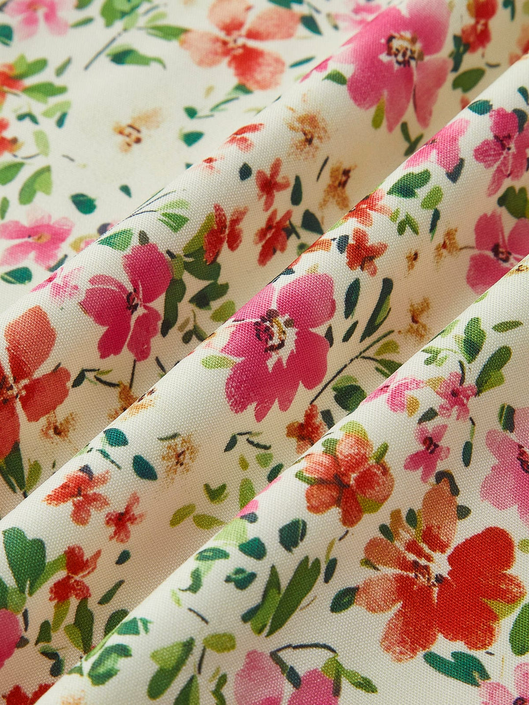 Stylish women's midi dress with a vibrant floral print. Feminine, romantic, ideal for warm weather occasions.