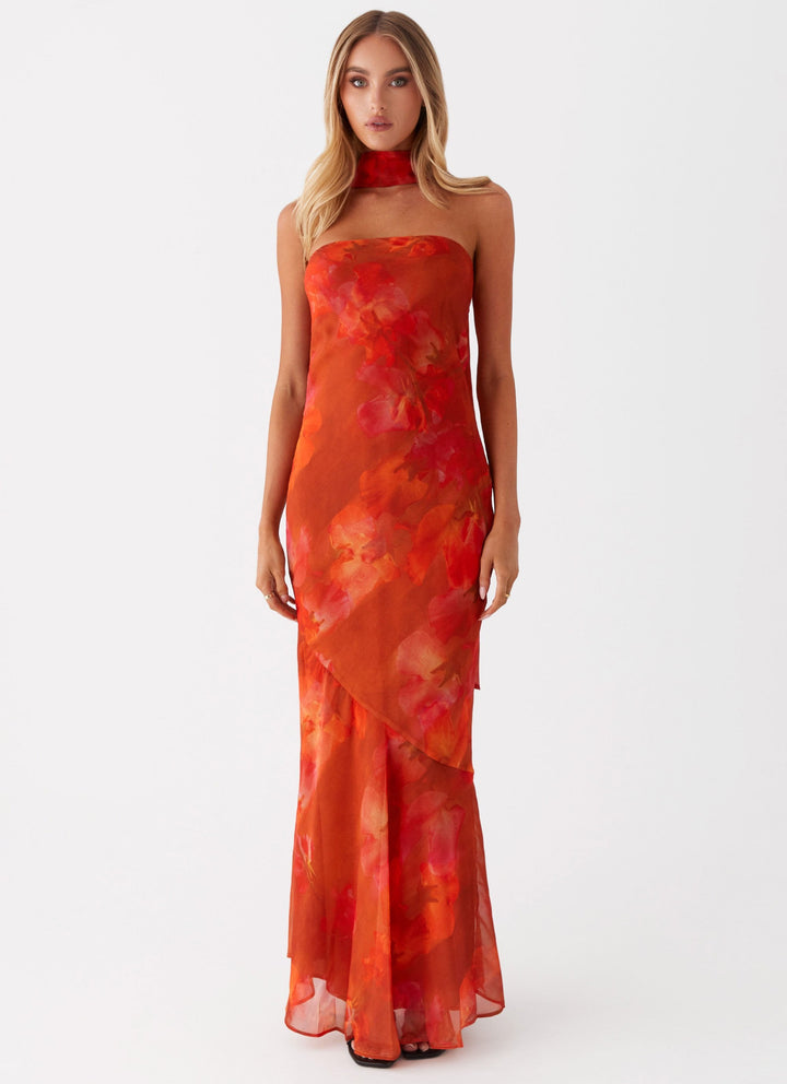 Women's romantic floral print flowing maxi dress. Elegant, sleeveless, perfect for summer occasions.