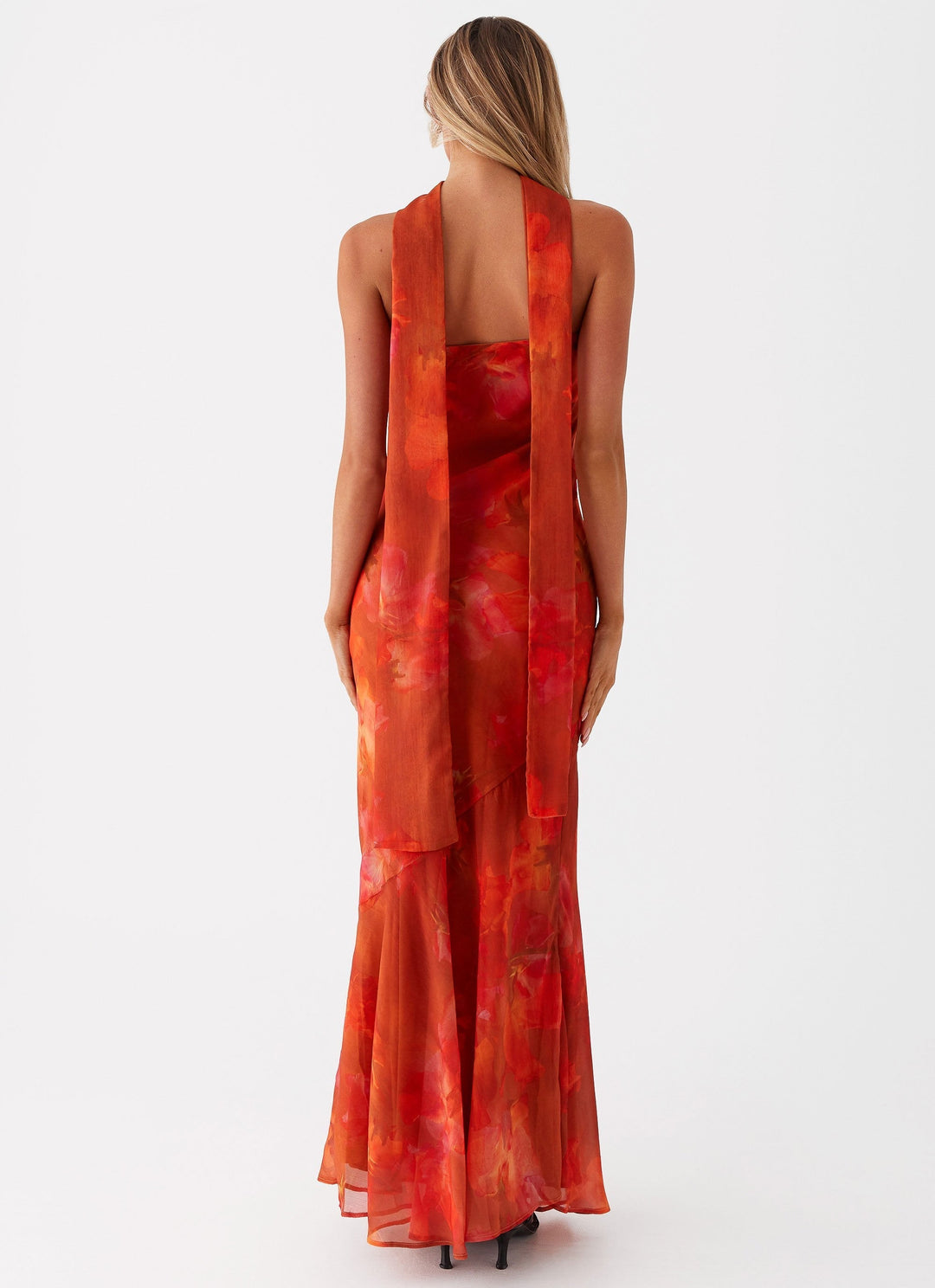 Elegant women's sleeveless maxi dress with a romantic floral print. Perfect flowy summer or occasion dress.
