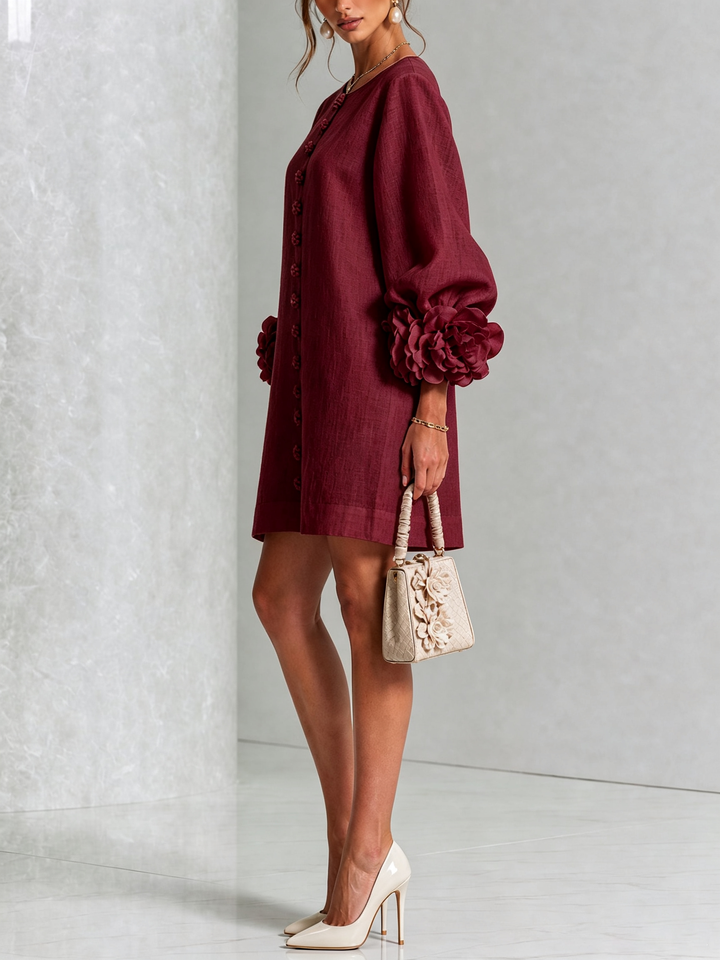 Spring/summer button-down long sleeve shift dress, a flowy silhouette.