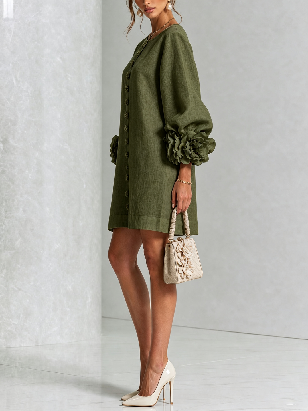 Women's fashionable long sleeve shift dress, featuring button details.