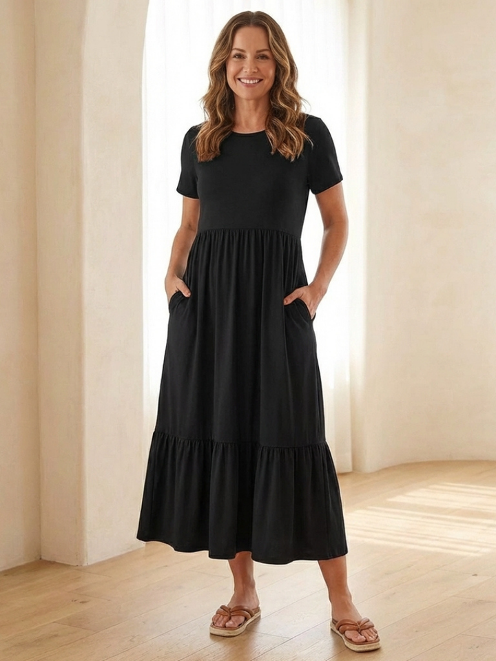 Women's round neck short sleeve tiered midi dress. Comfortable and relaxed fit, perfect for casual summer wear.
