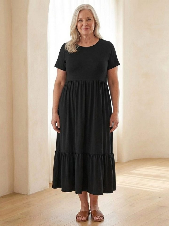 Versatile women's midi dress with a round neck, short sleeves & tiered skirt. Features practical pockets & a relaxed fit.