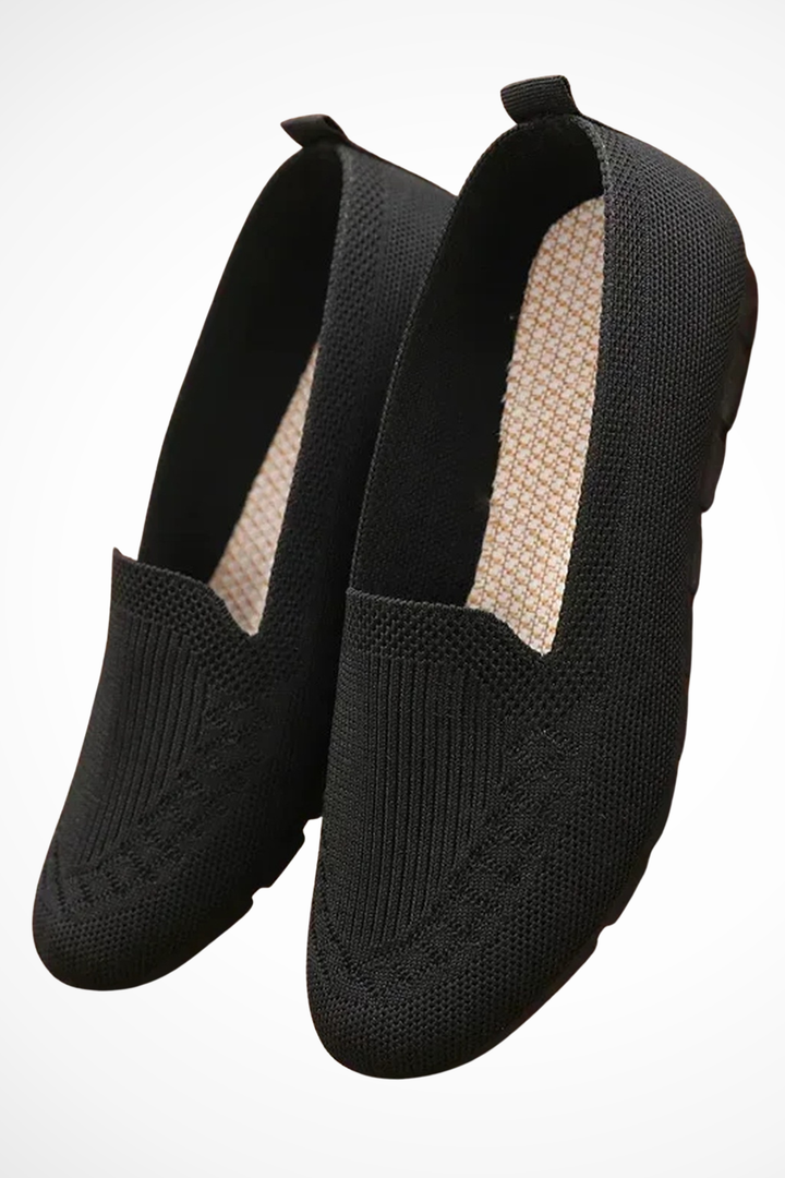 Purple round toe slip-on ballet flats, ideal everyday comfort footwear for women.