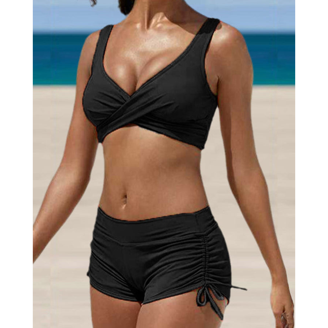 Flattering women's two-piece bikini set with ruched shorts, available in blue, black & wine red for pool parties.
