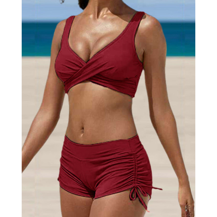 Stylish women's two-piece ruched shorts swimsuit, ideal for vacation beachwear & summer activities.