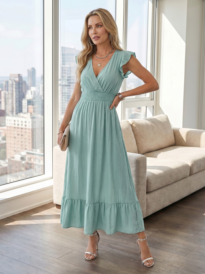 Versatile women's midi dress: smocked waist, ruffle sleeves, and tiered skirt for casual or elegant summer wear.