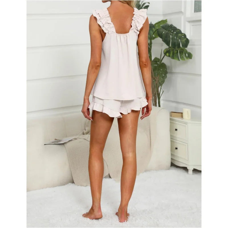 Soft women's comfortwear set, sleeveless top and drawstring shorts, accented with feminine ruffle trim.