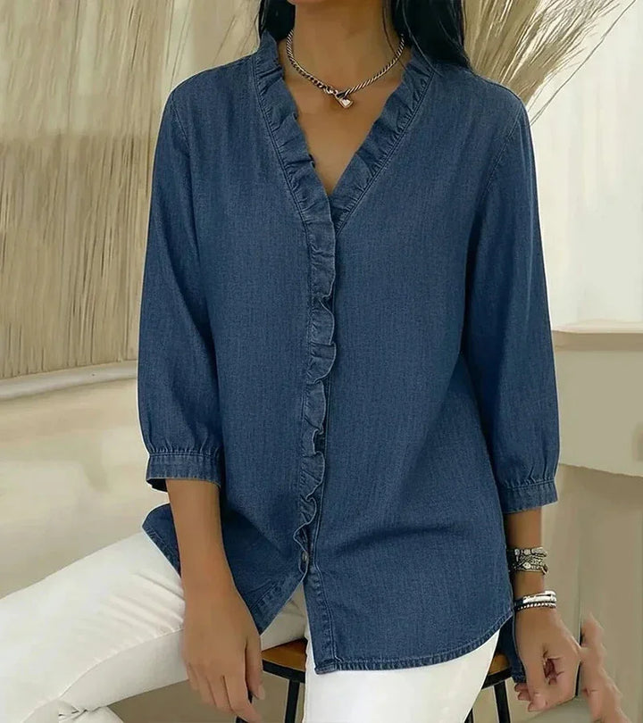 Elegant women's v-neck blouse. With comfortable 3/4 sleeves & a flattering hi-low hem for office or casual.