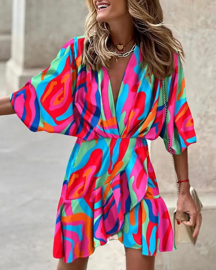 Model wearing a short women's boho mini dress with ruffles, ideal for casual summer fashion or bohemian outings.
