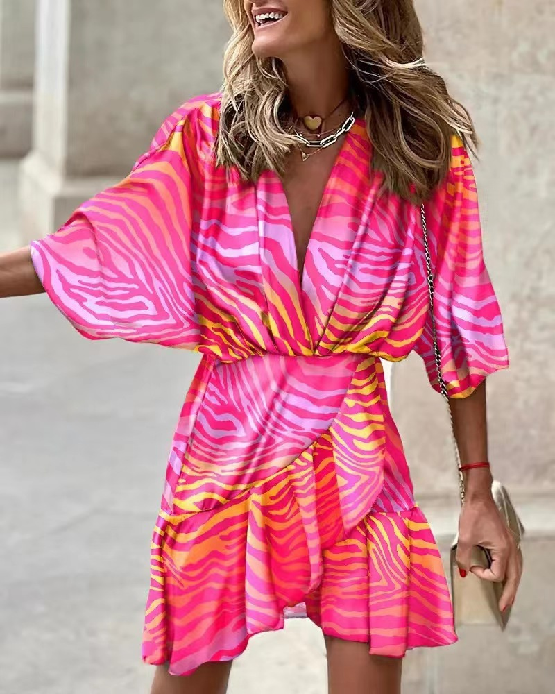 Stylish women's bohemian mini dress featuring ruffles and a playful short hem, great for casual summer wear.