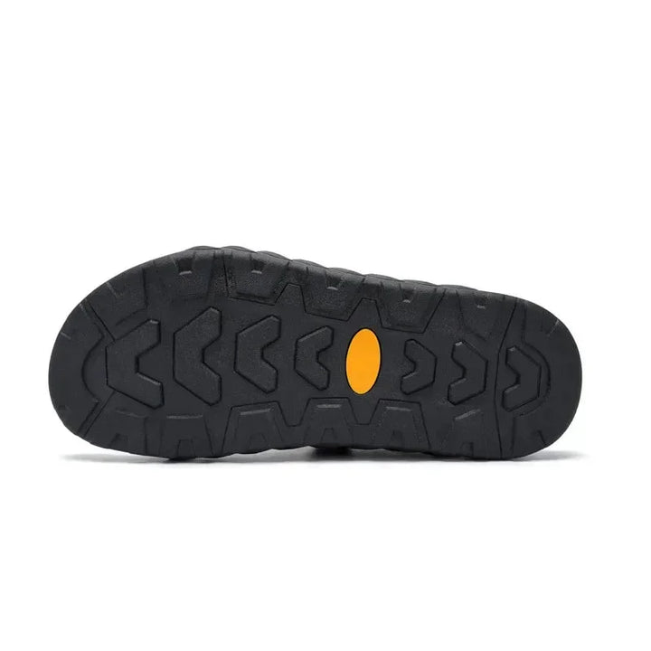 Black women's outdoor sandals, adjustable straps & secure buckle, robust lug sole for summer comfort.