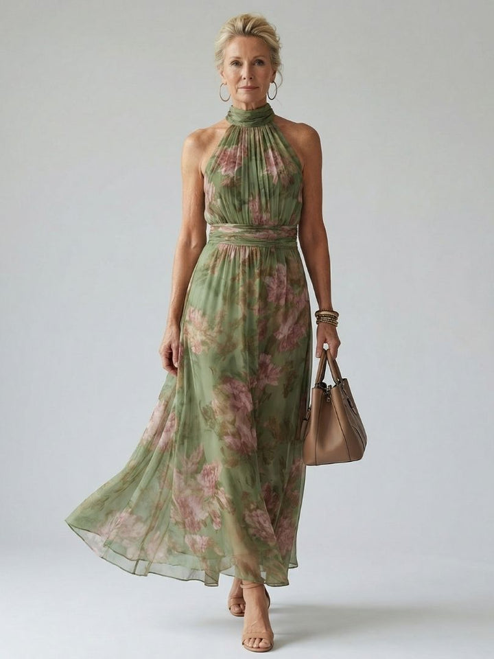 Women's sage green floral halter neck midi dress, perfect for summer garden parties & elegant occasions.