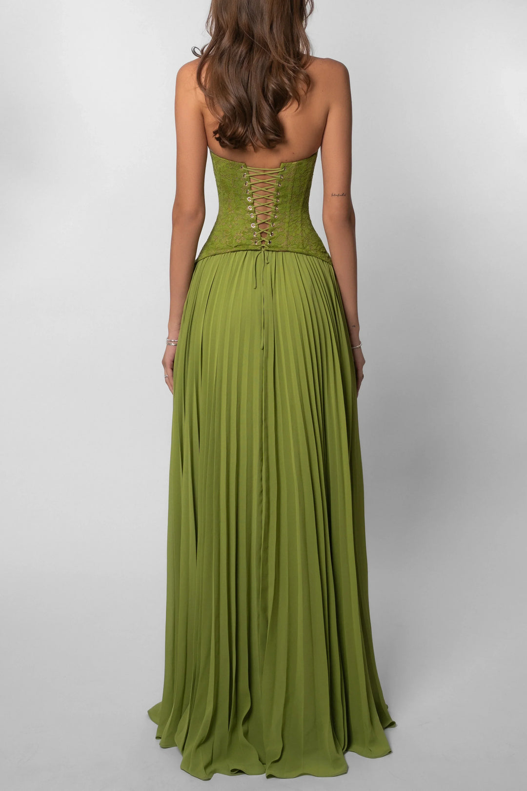 Sophisticated sage green pleated corset maxi dress for women, suitable for formal evening wear and events.