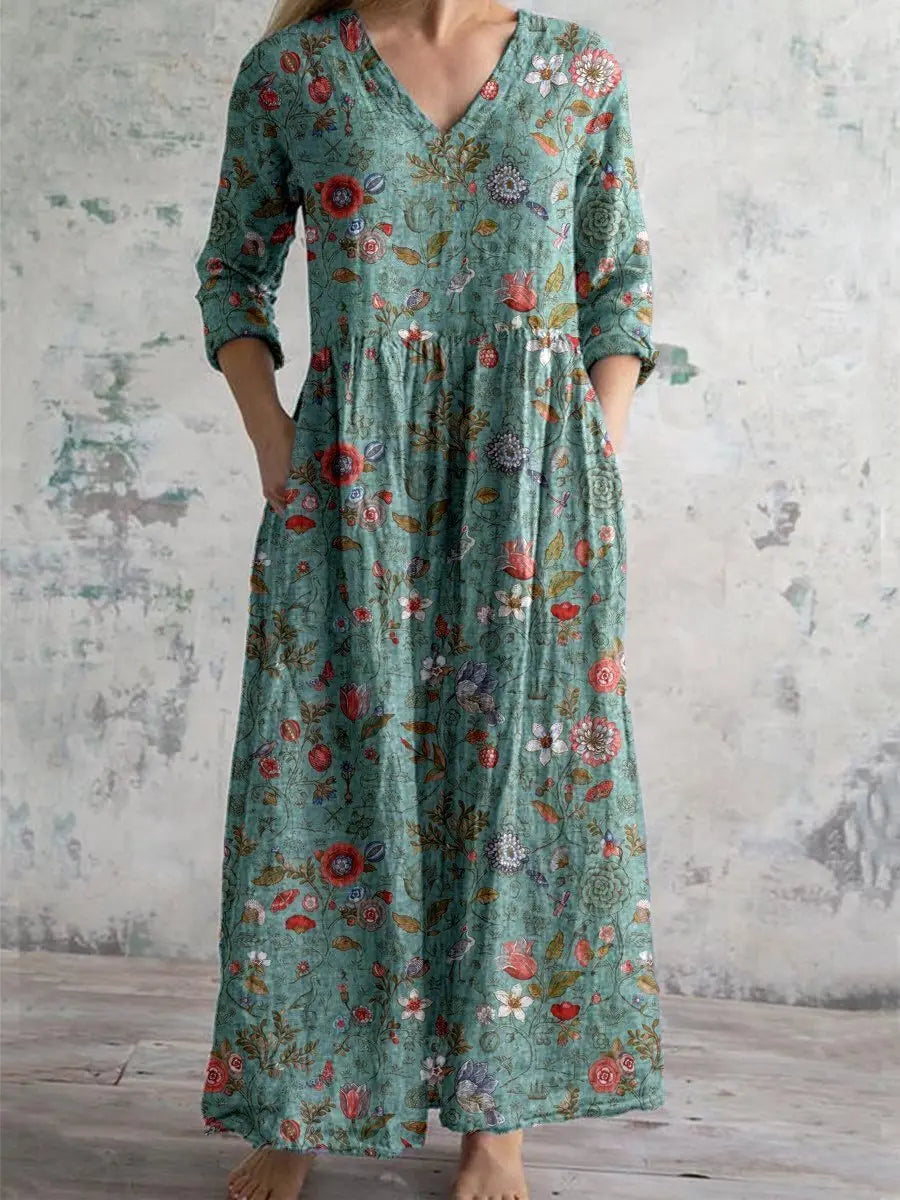 Women's sage green V-neck bohemian floral maxi dress with three-quarter sleeves & pockets, perfect for summer casual wear.