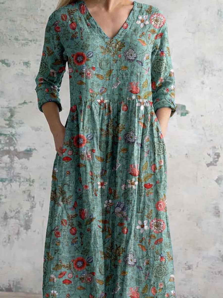Comfortable women's floral maxi dress, sage green, featuring a V-neck, three-quarter sleeves, pockets & bohemian style.