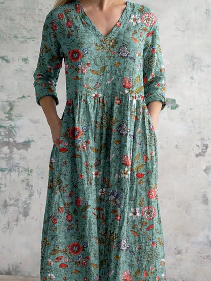 Comfortable women's floral maxi dress, sage green, featuring a V-neck, three-quarter sleeves, pockets & bohemian style.