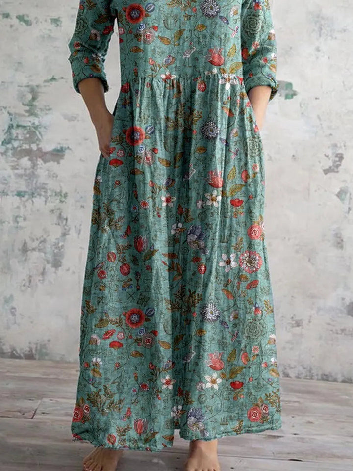 Stylish women's bohemian floral maxi dress in sage green, V-neck, three-quarter sleeves, pockets for casual summer fashion.