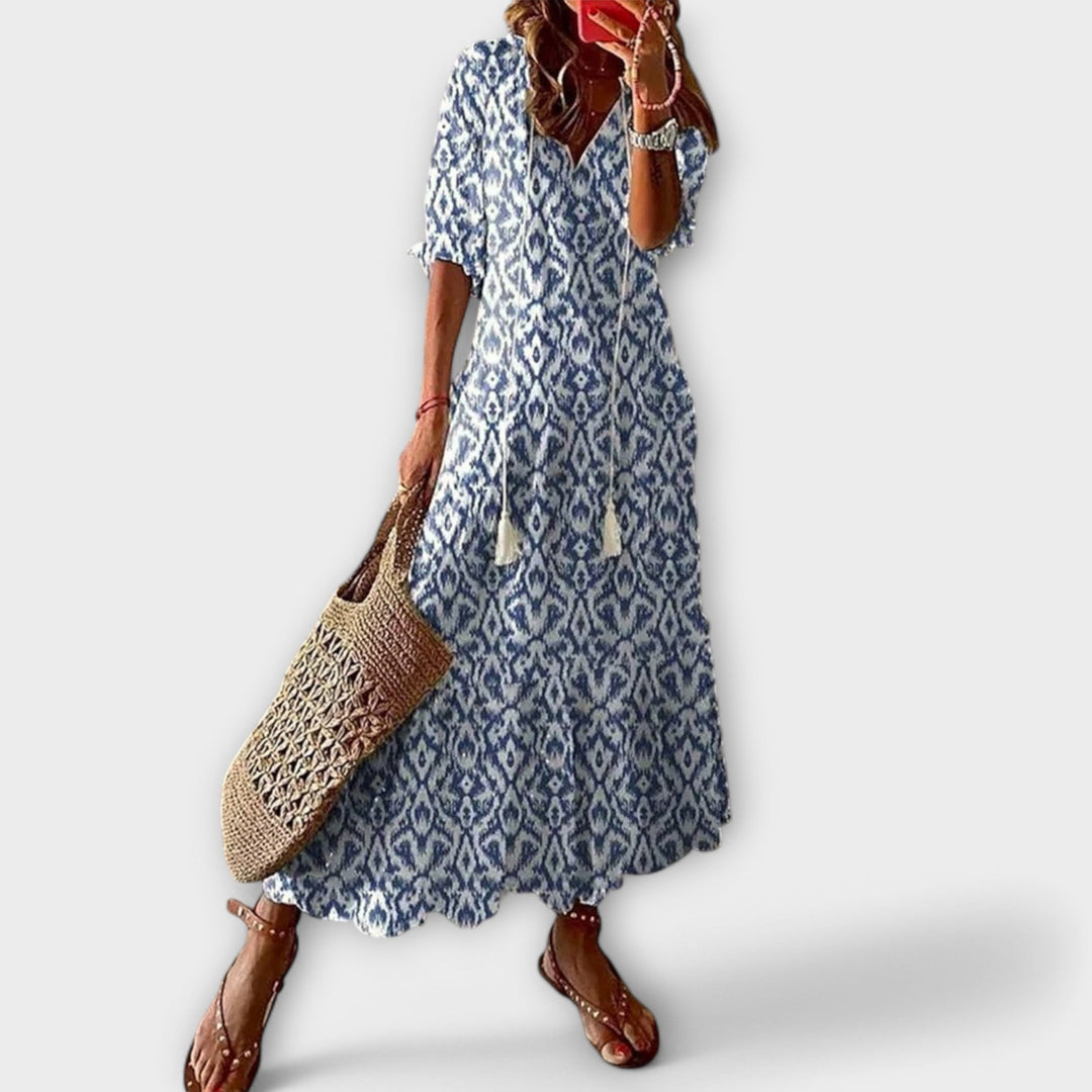 Women's Savannah elegant maxi dress with a flowy silhouette, perfect for summer fashion and versatile wear.