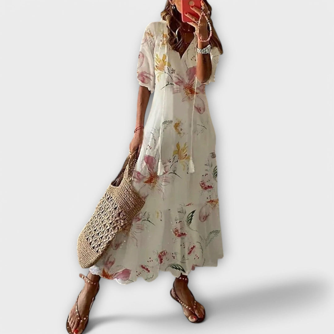 Elegant women's Savannah maxi dress with a beautiful printed design and flowy silhouette, perfect for summer.